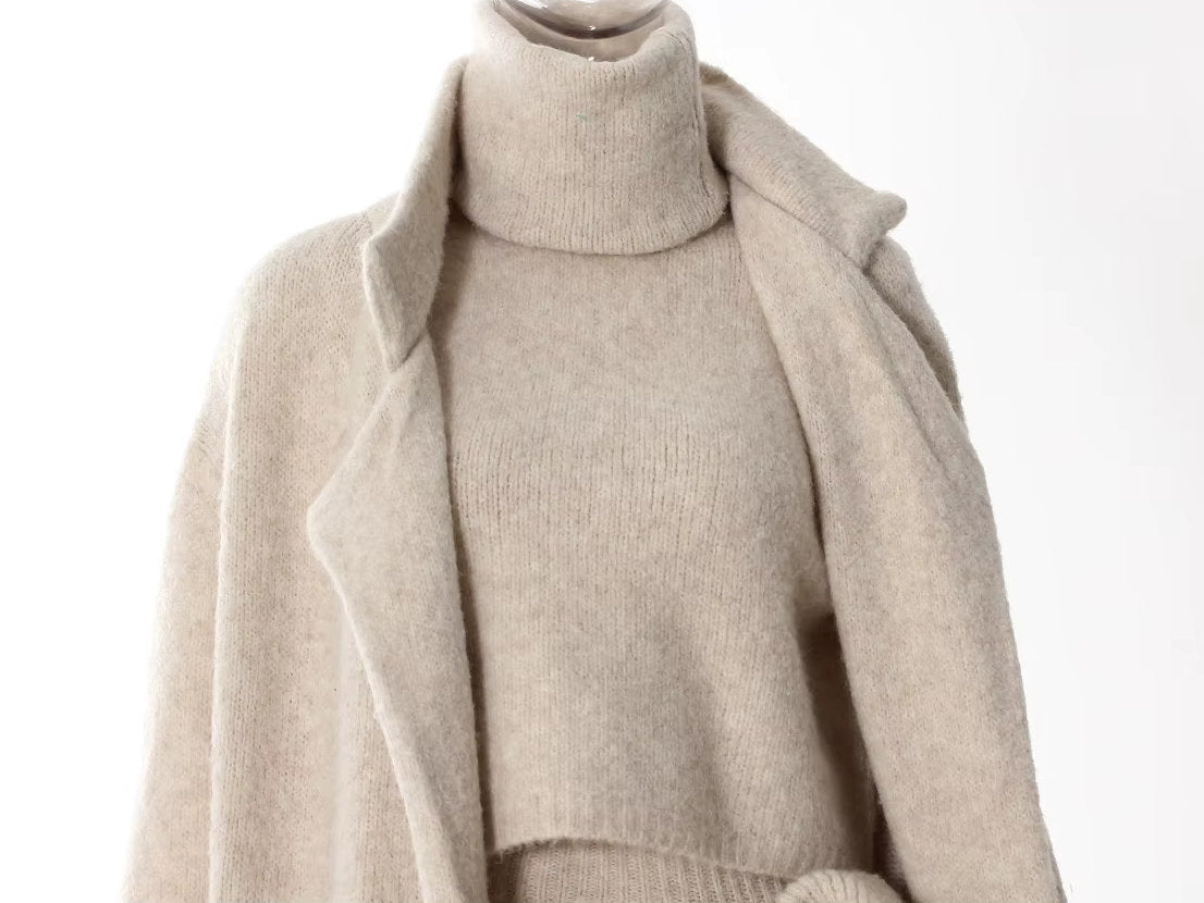 Cozy knitwear ensemble featuring a sleeveless turtleneck and flower applique skirt