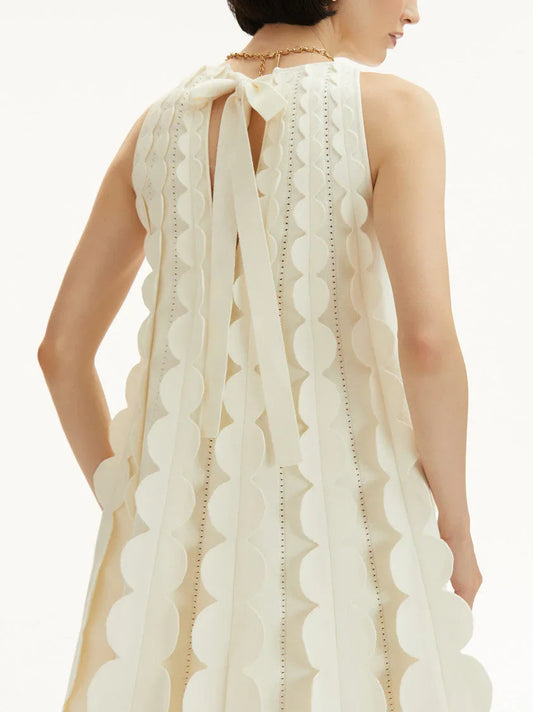 Ivory 3D Circle Trapeze Knit Mini Dress with circular appliqués and ribbon tie design