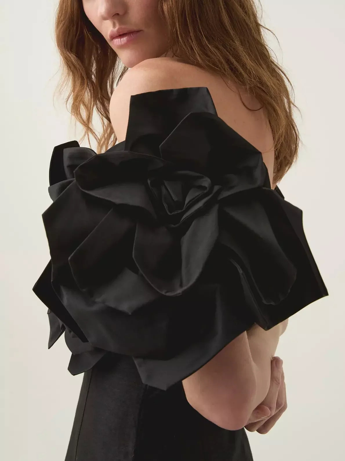 Black off-shoulder gown with floral-appliques bodice for elegant evening wear