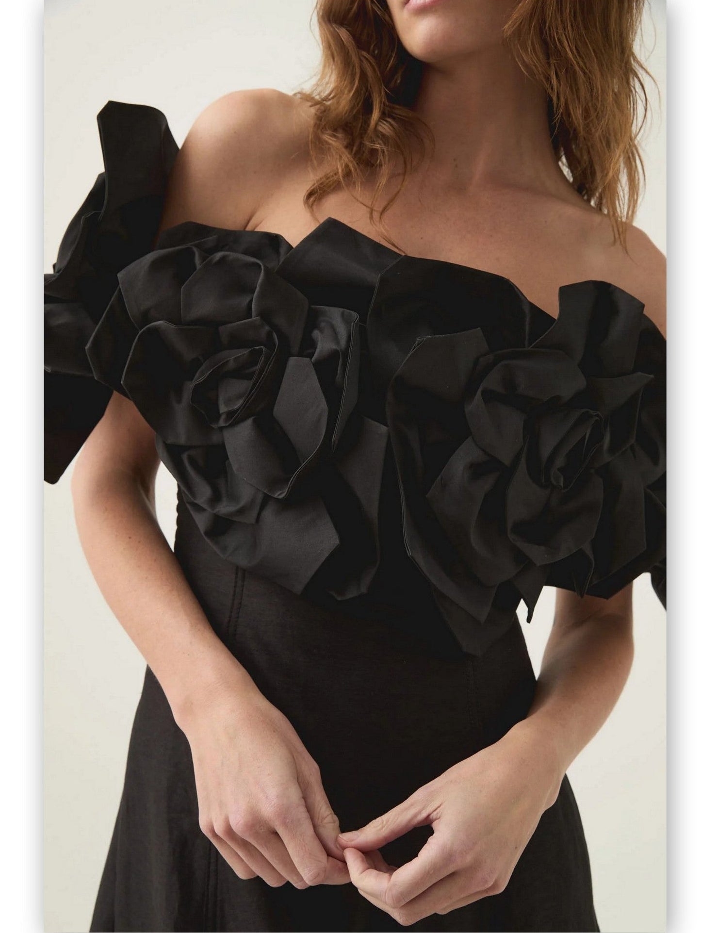 Black floral-appliques off-shoulder gown featuring a stunning floral bodice design
