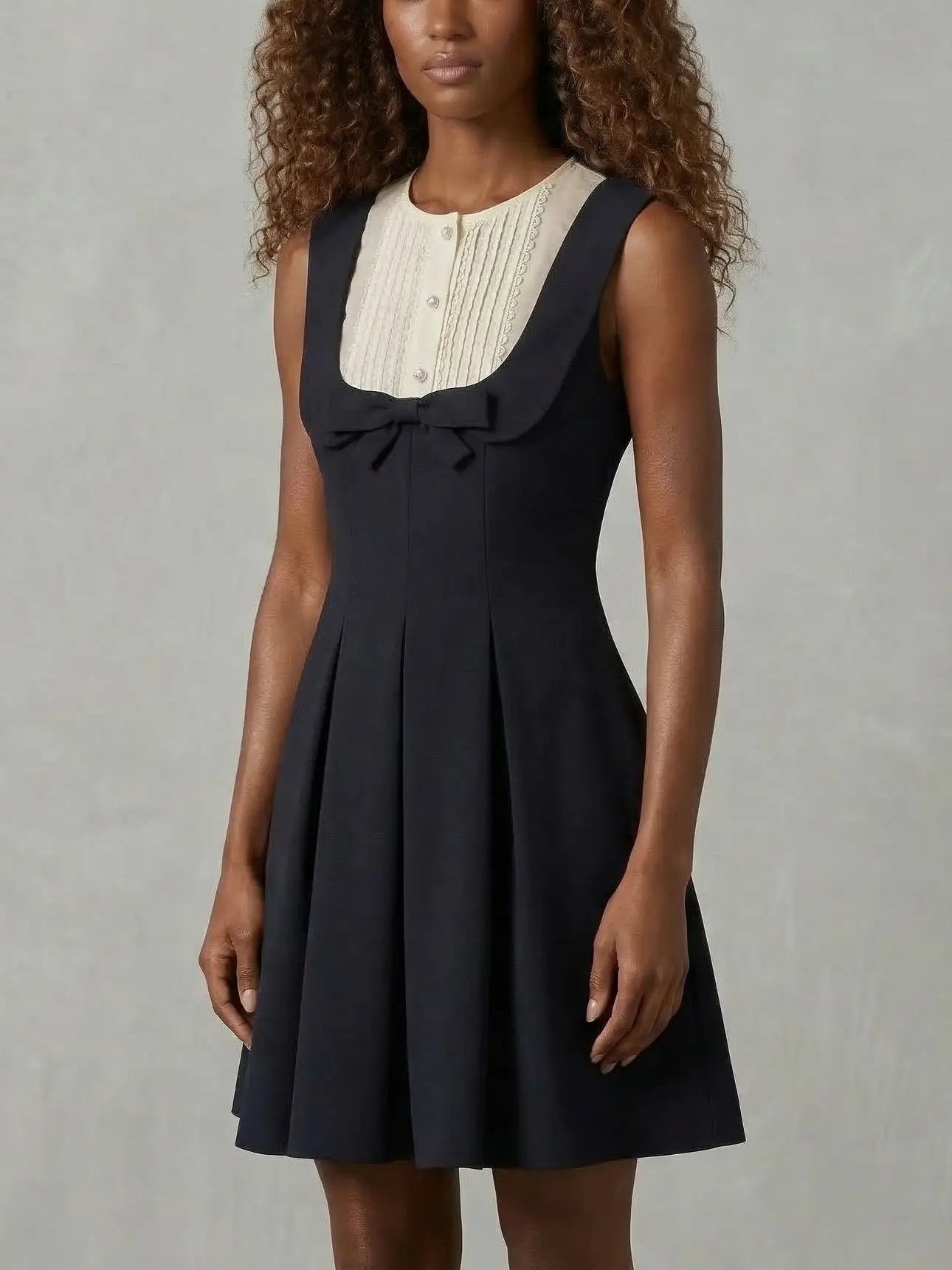 Black Sleeveless Mini Dress with Bow and Contrast Bib - Dresses