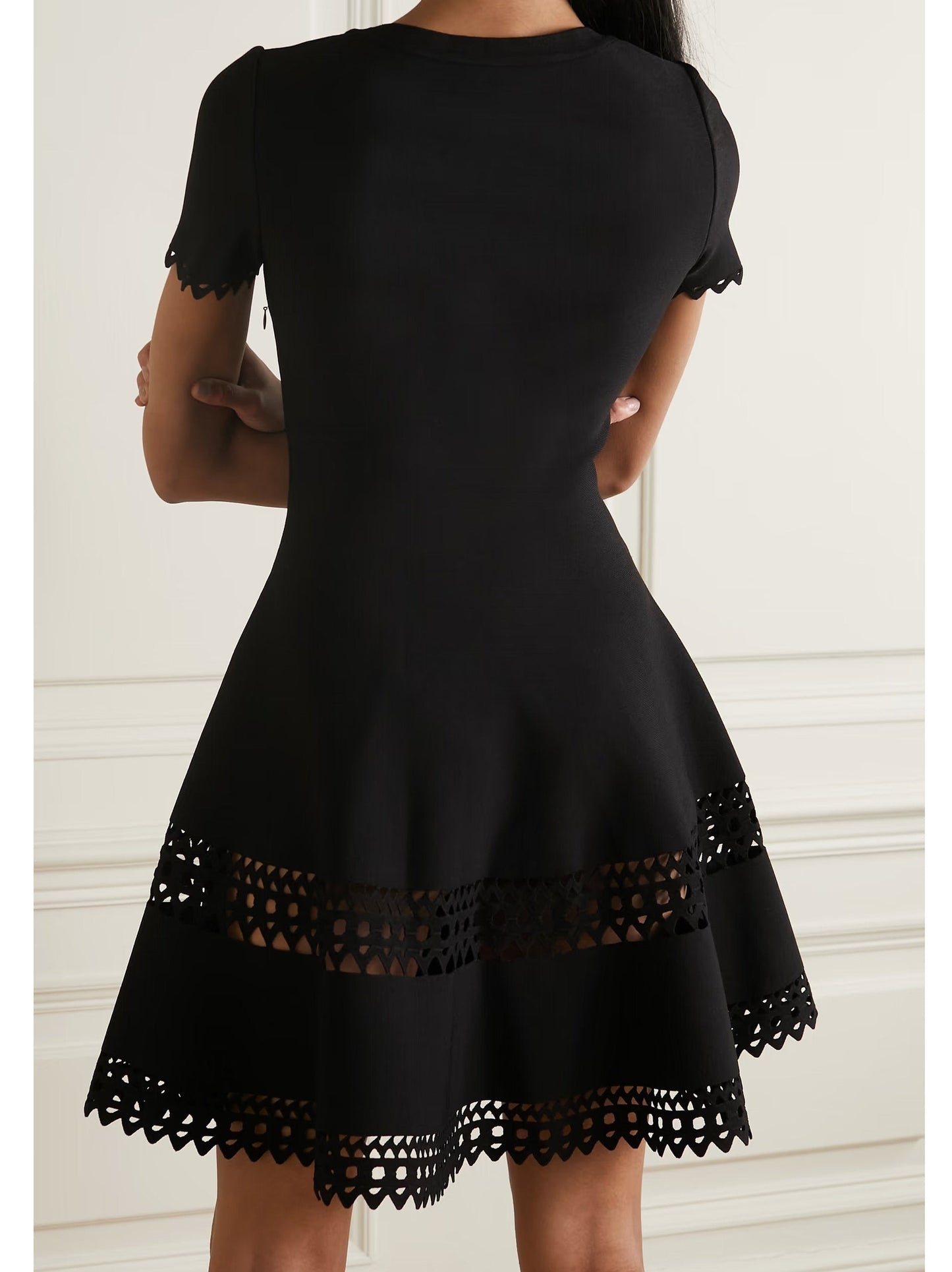Black fit-and-flare A-Line Cut-Out Stretch Knit Mini Dress showcasing stylish cutout details
