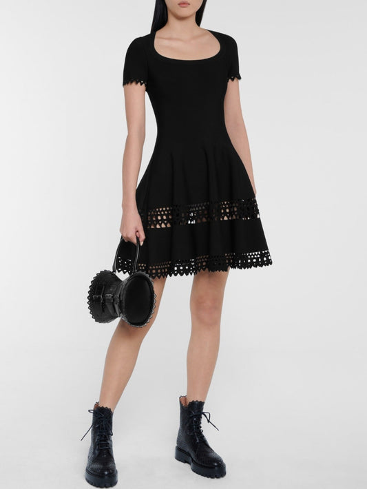 Black A-Line Cut-Out Stretch Knit Mini Dress showcasing a stylish fit-and-flare design