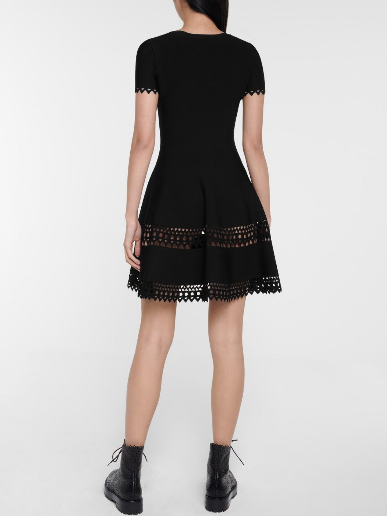 Black A-Line Cut-Out Stretch Knit Mini Dress showcasing a flattering fit-and-flare design