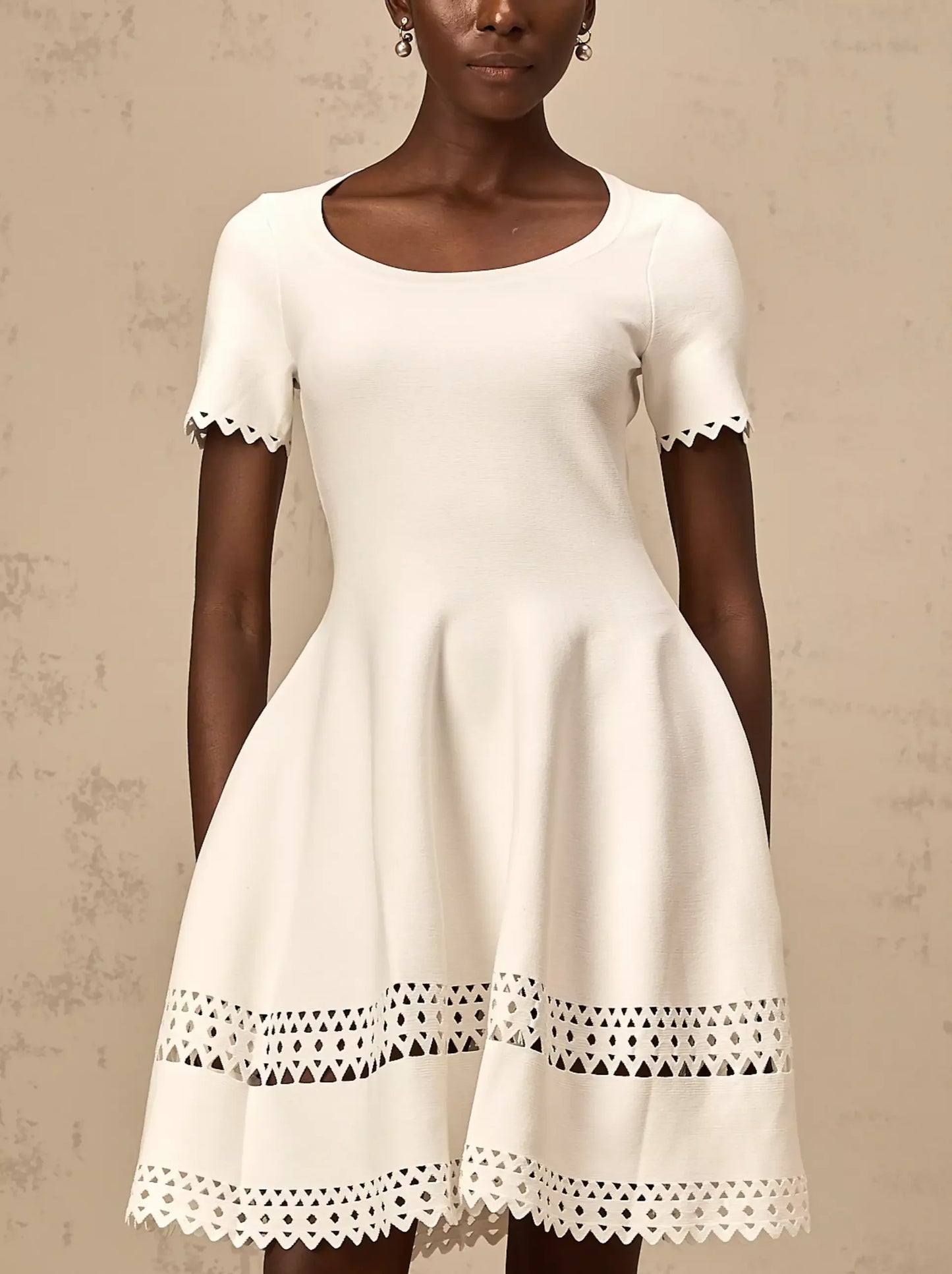 White A-Line Cut-Out Stretch Knit Mini Dress with scalloped trim for a chic look