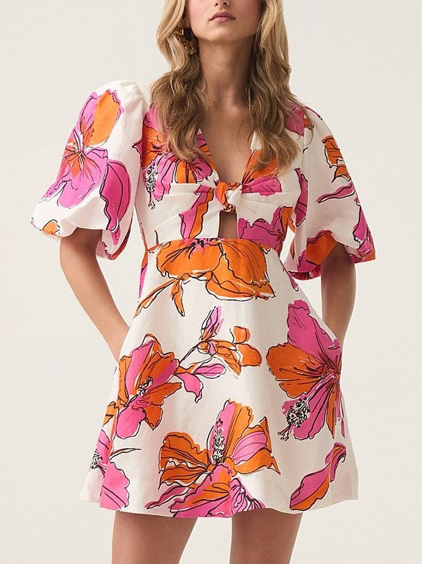 Floral print mini dress featuring an Abstract Hibiscus Print and knotted puff sleeves