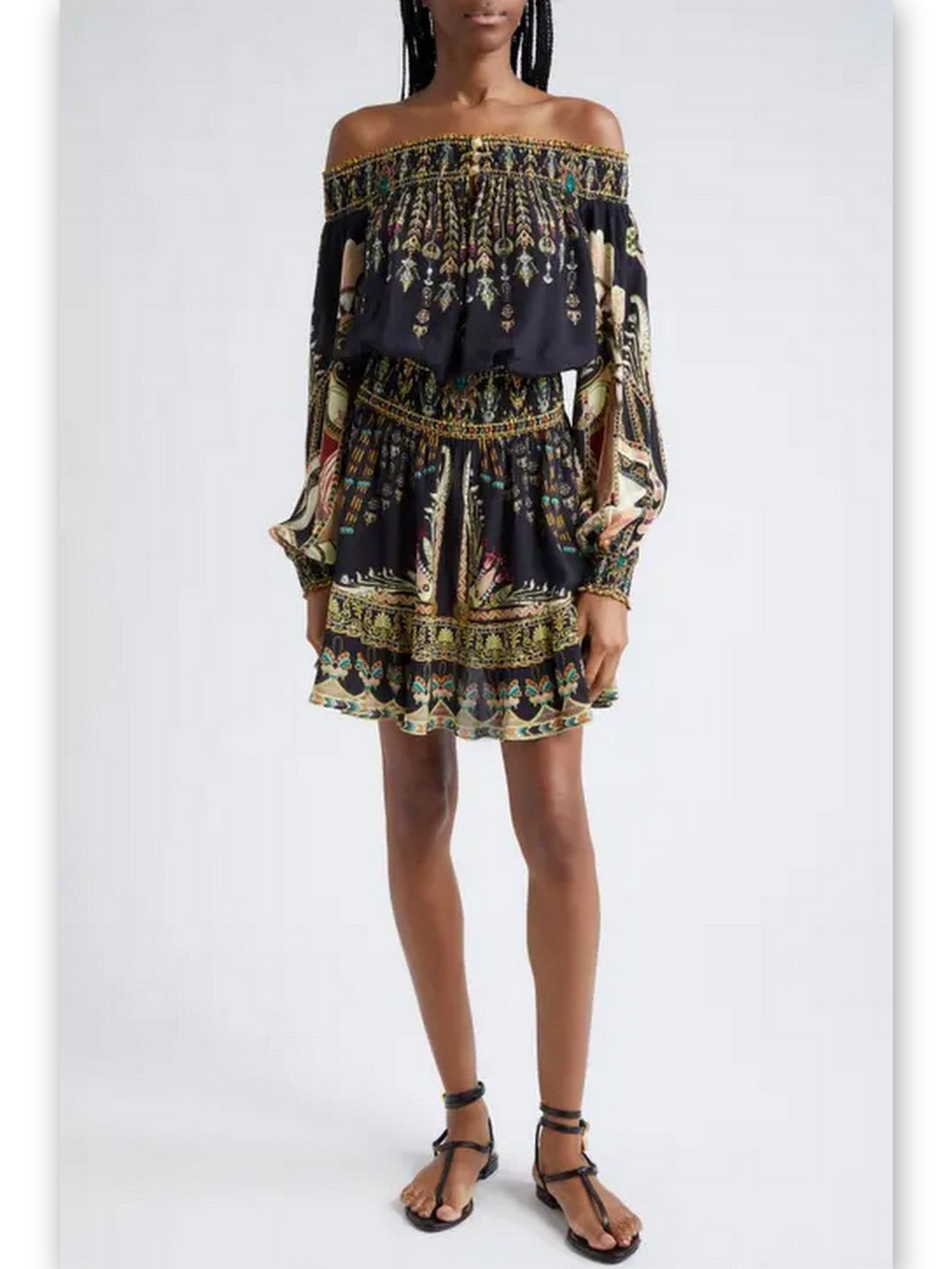 Black patterned silk mini dress featuring an Ancient Egyptian print off-shoulder design