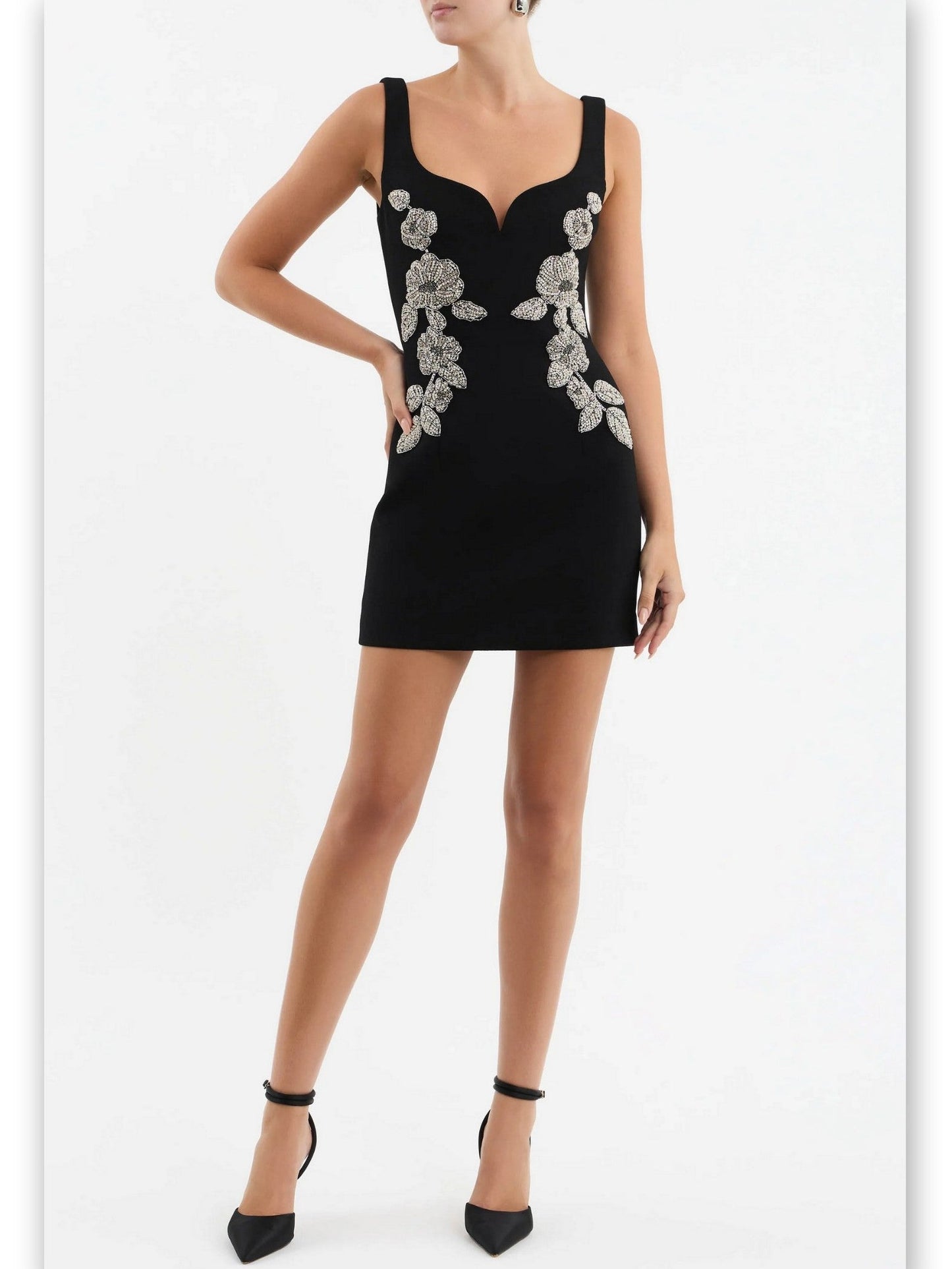 Bead-embellished black sleeveless mini dress with floral embellishments for stylish looks