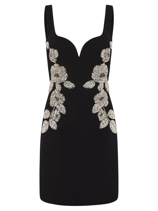 Bead-embellished black sleeveless mini dress with floral embellishments displayed elegantly