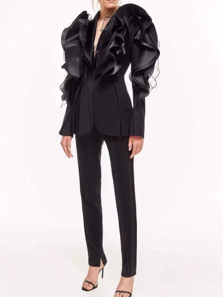 Black tiered ruffled tuxedo jacket featuring stylish ruffles and a sophisticated design