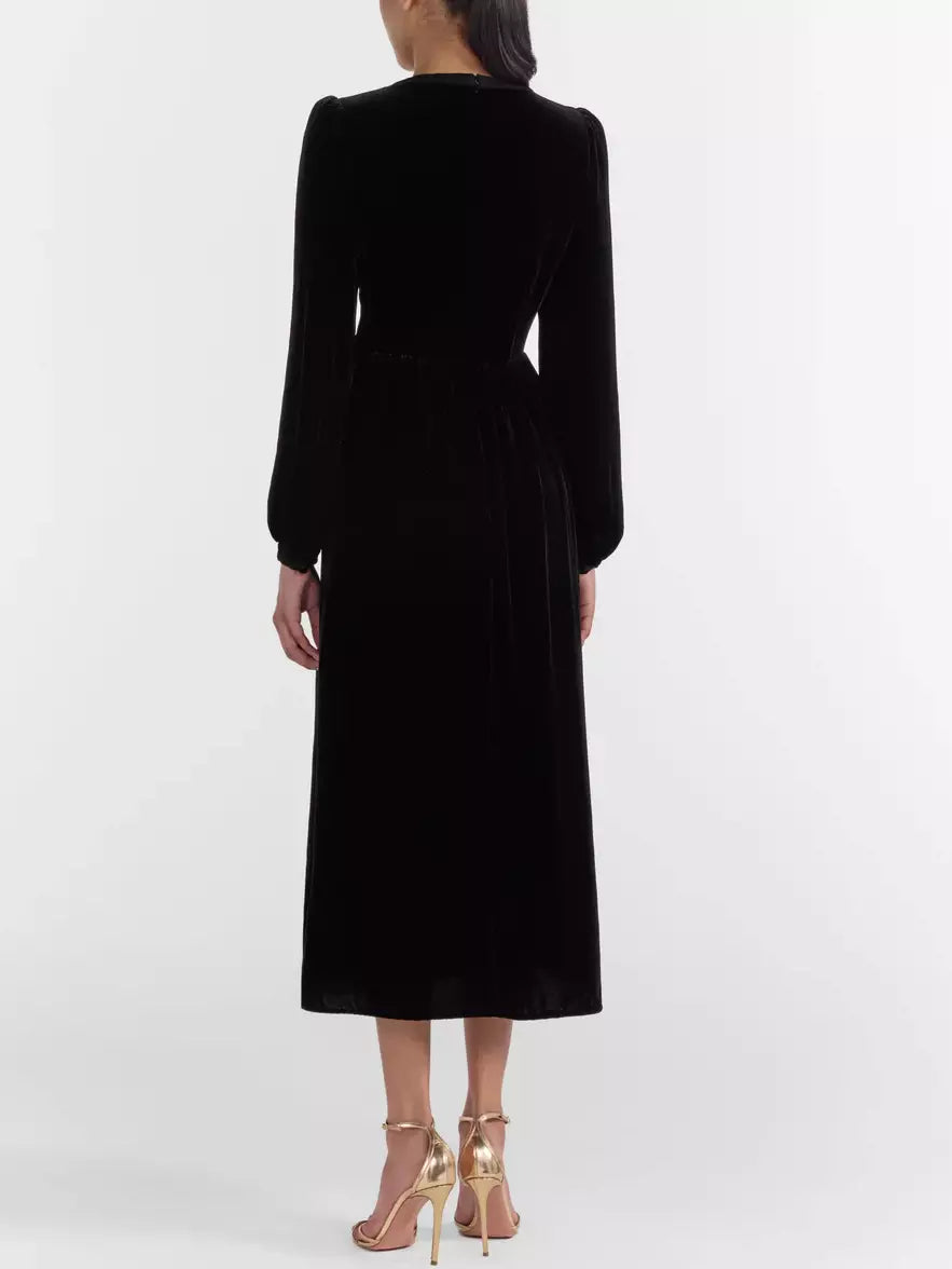 Black Velvet Bow-Embellished Midi Dress showcasing luxurious fabric and elegant design