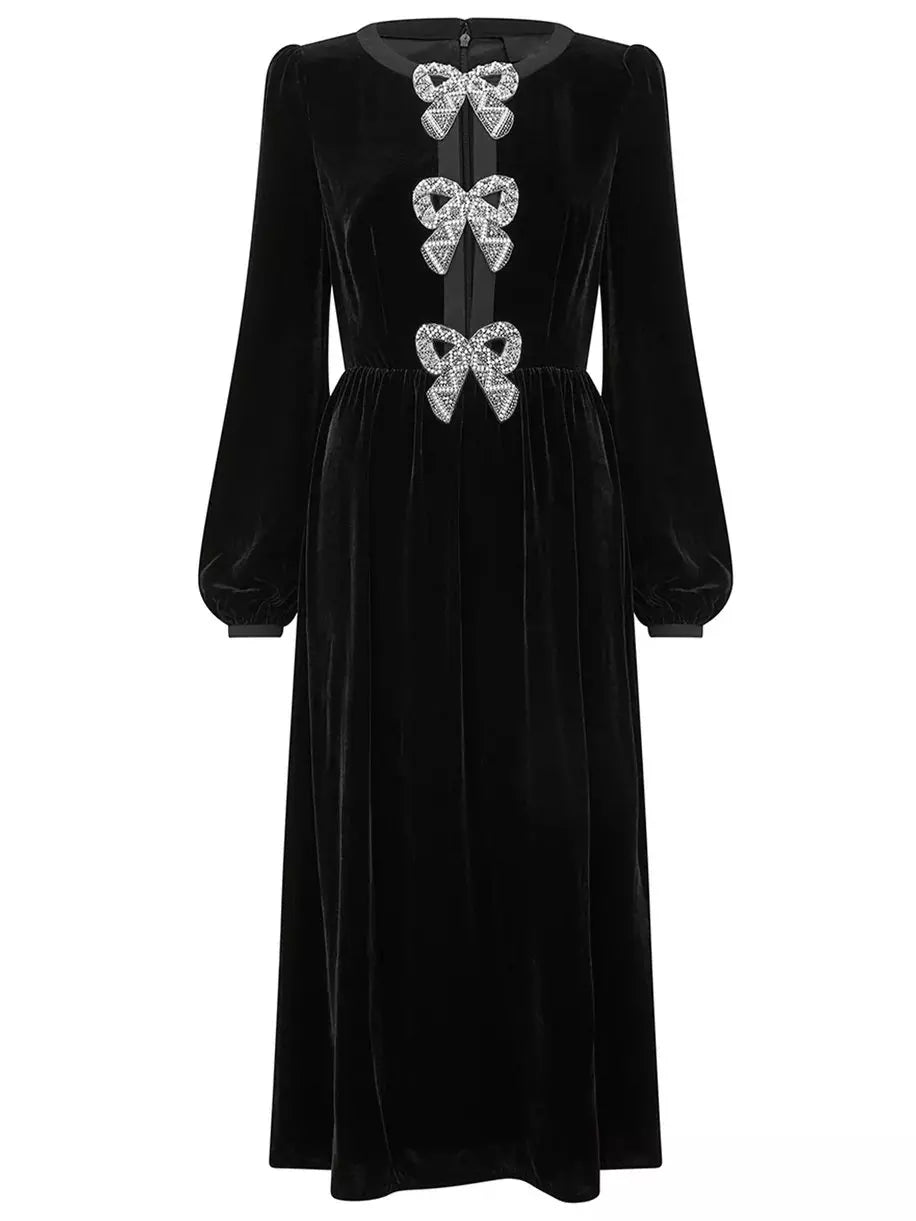 Black Velvet Bow-Embellished Midi Dress featuring elegant bow embellishments on soft velvet