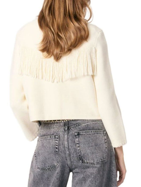 Cream knit fringed cardigan with gold buttons paired with gray jeans
