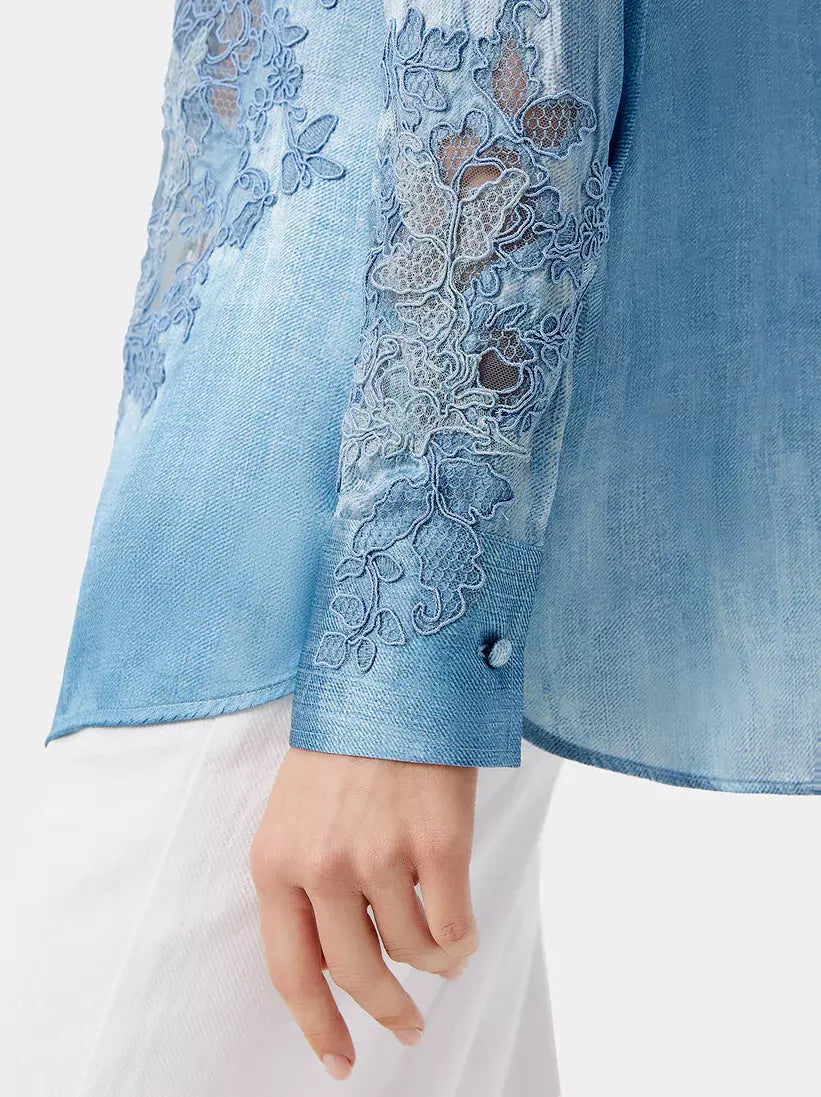 Blue washed silk blouse with elegant lace embellishments for a stylish look