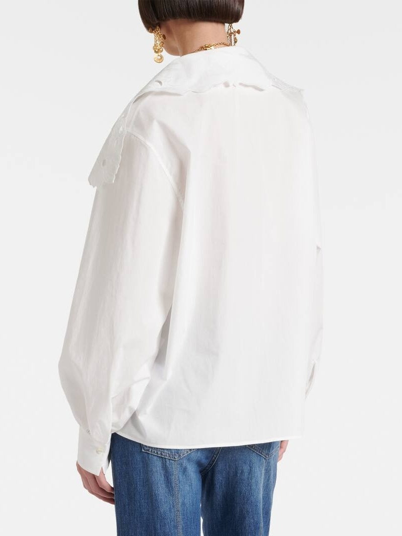 Woman in Broderie Anglaise Cotton Poplin Blouse with blue jeans