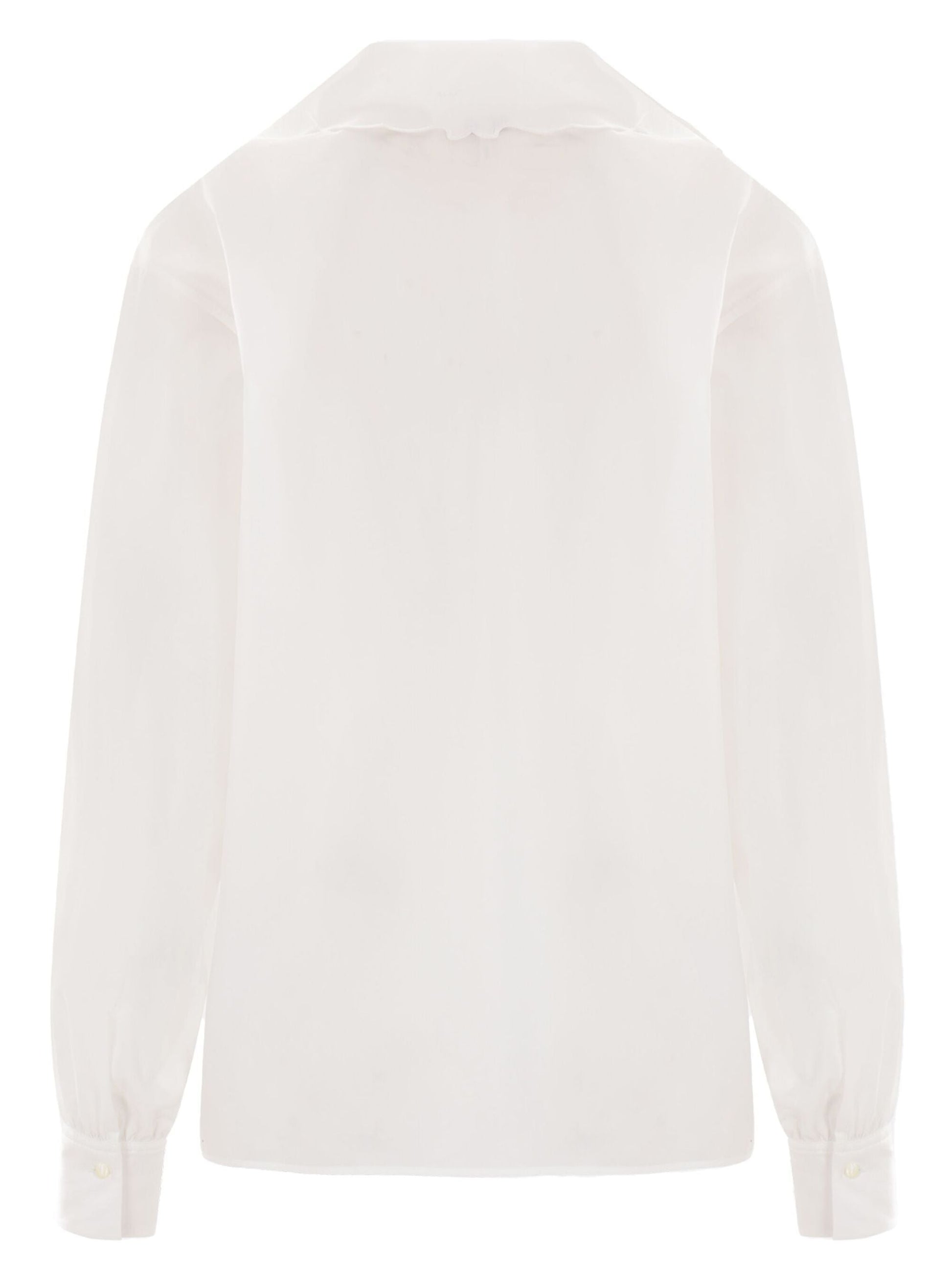 White eyelet-trimmed Broderie Anglaise Cotton Poplin Blouse with high-waisted jeans