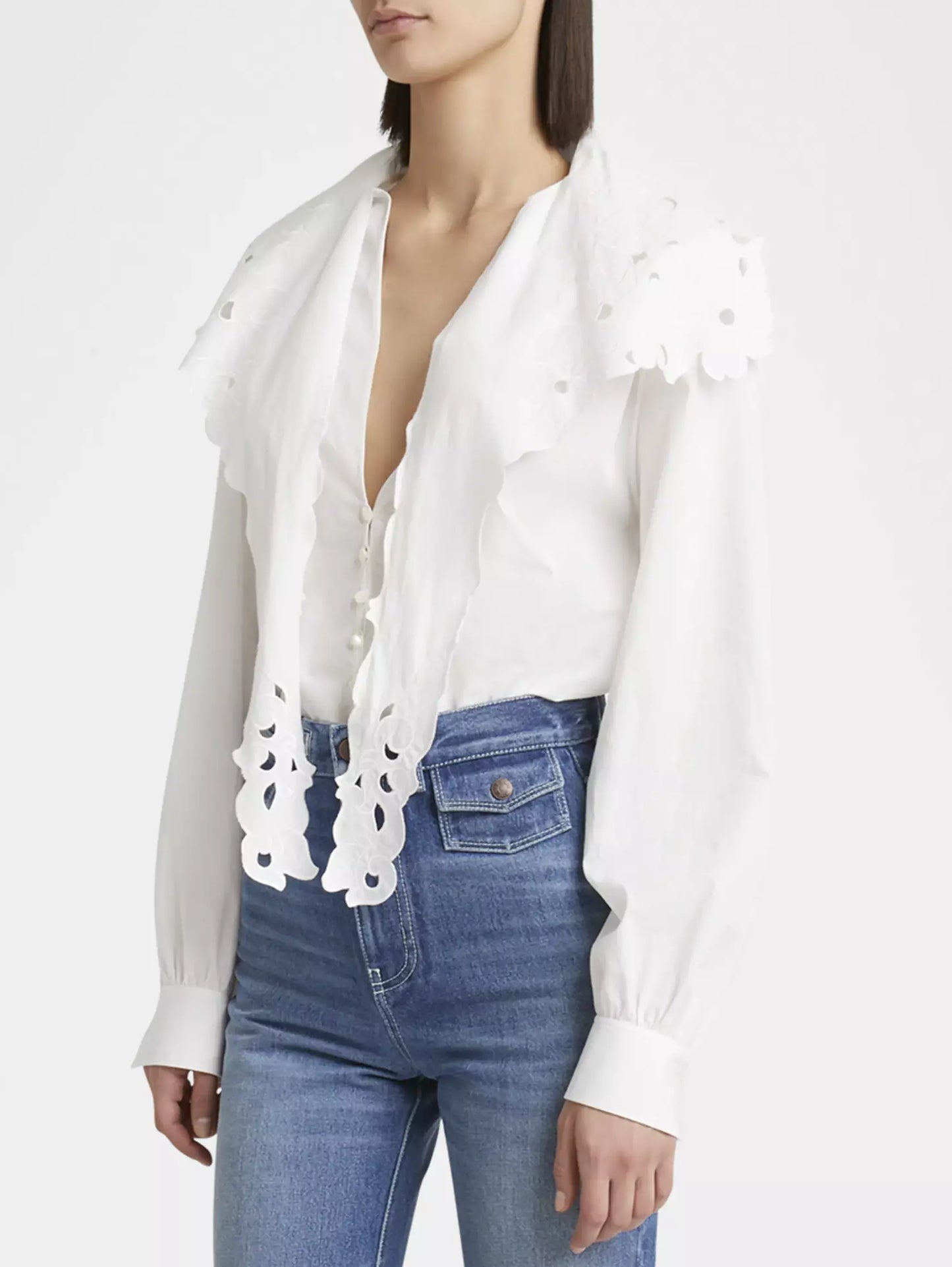 White eyelet-trimmed Broderie Anglaise Cotton Poplin Blouse with high-waisted jeans
