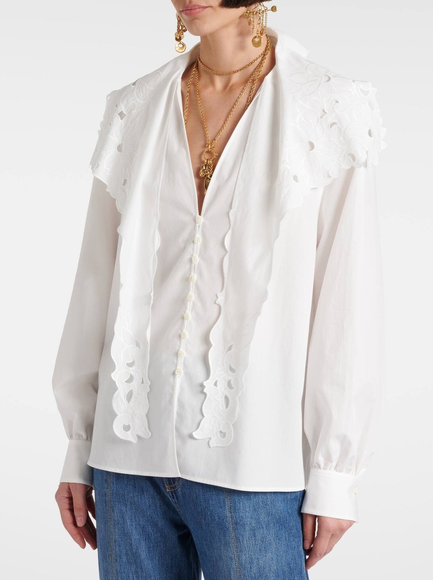 White eyelet-trimmed Broderie Anglaise Cotton Poplin Blouse with high-waisted jeans