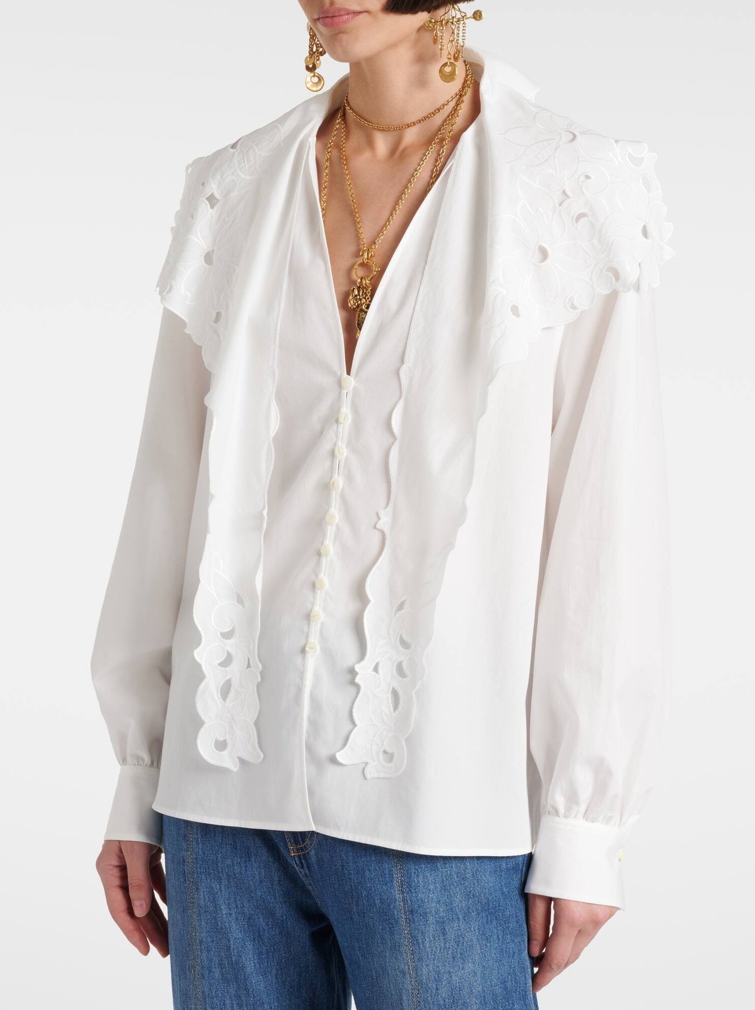 White eyelet-trimmed Broderie Anglaise Cotton Poplin Blouse with high-waisted jeans