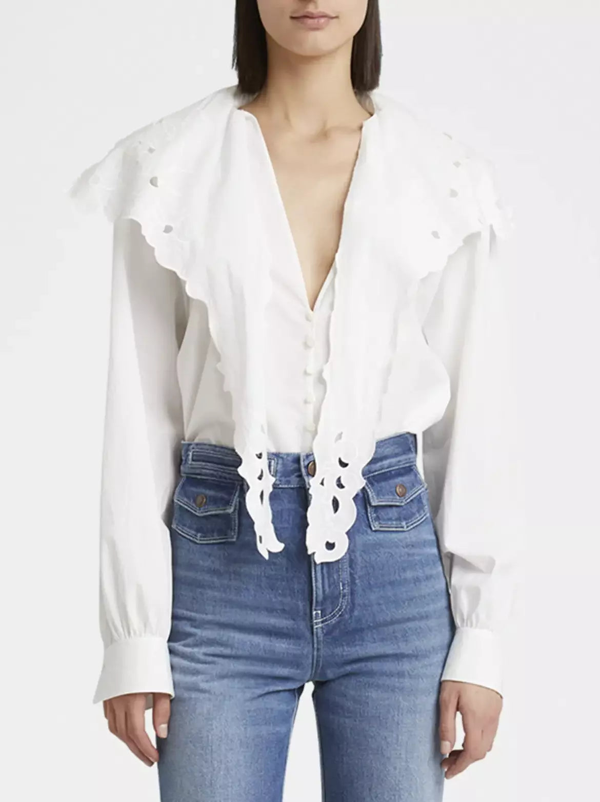 White eyelet-trimmed Broderie Anglaise Cotton Poplin Blouse with high-waisted jeans