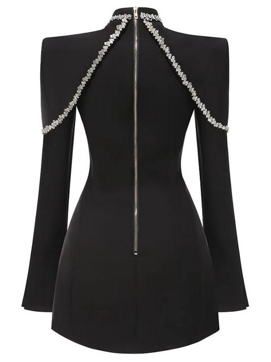 Black long-sleeve mini dress adorned with crystal embellishments for a glamorous look