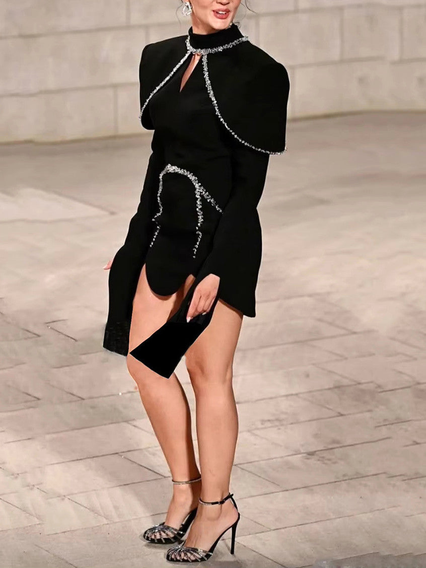 Black long-sleeve mini dress featuring stunning crystal embellishments for elegant style