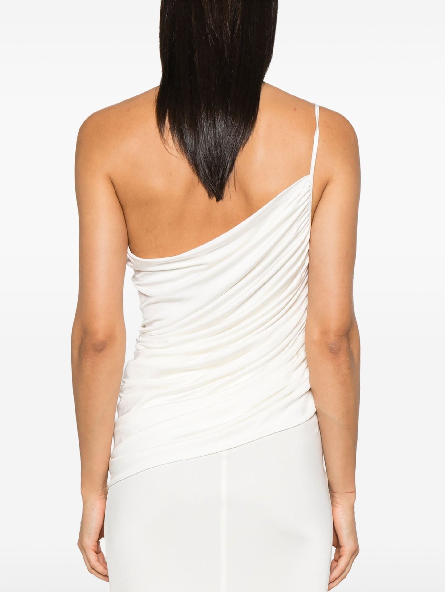 White one-shoulder draped jersey top featuring a detachable rose brooch accessory