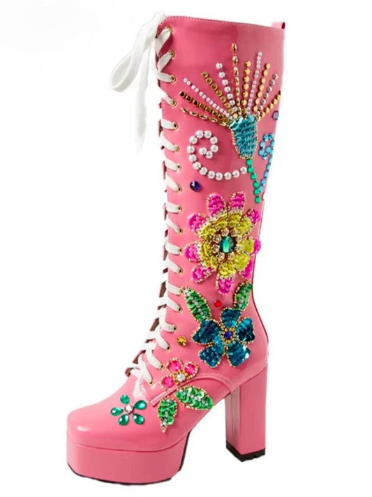 Pink embellished lace-up leather platform boots with floral embellishments