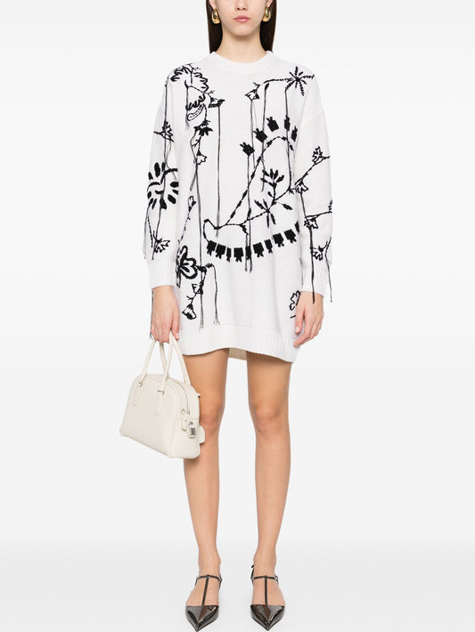 White oversized sweater dress with black floral embroidery in embroidered knit oversized style