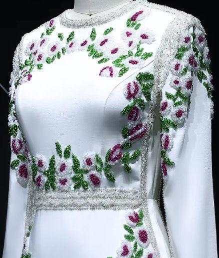Elegant floral bead-embellished long white fitted gown with delicate embellishments