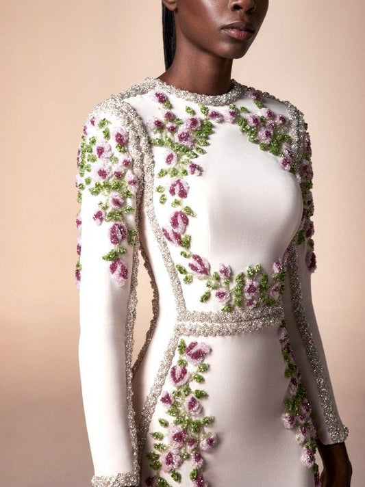 Elegant floral bead-embellished long white fitted gown with intricate floral details