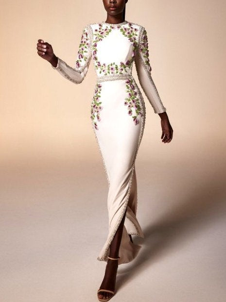 Elegant floral bead-embellished long white fitted gown with beaded accents and long sleeves