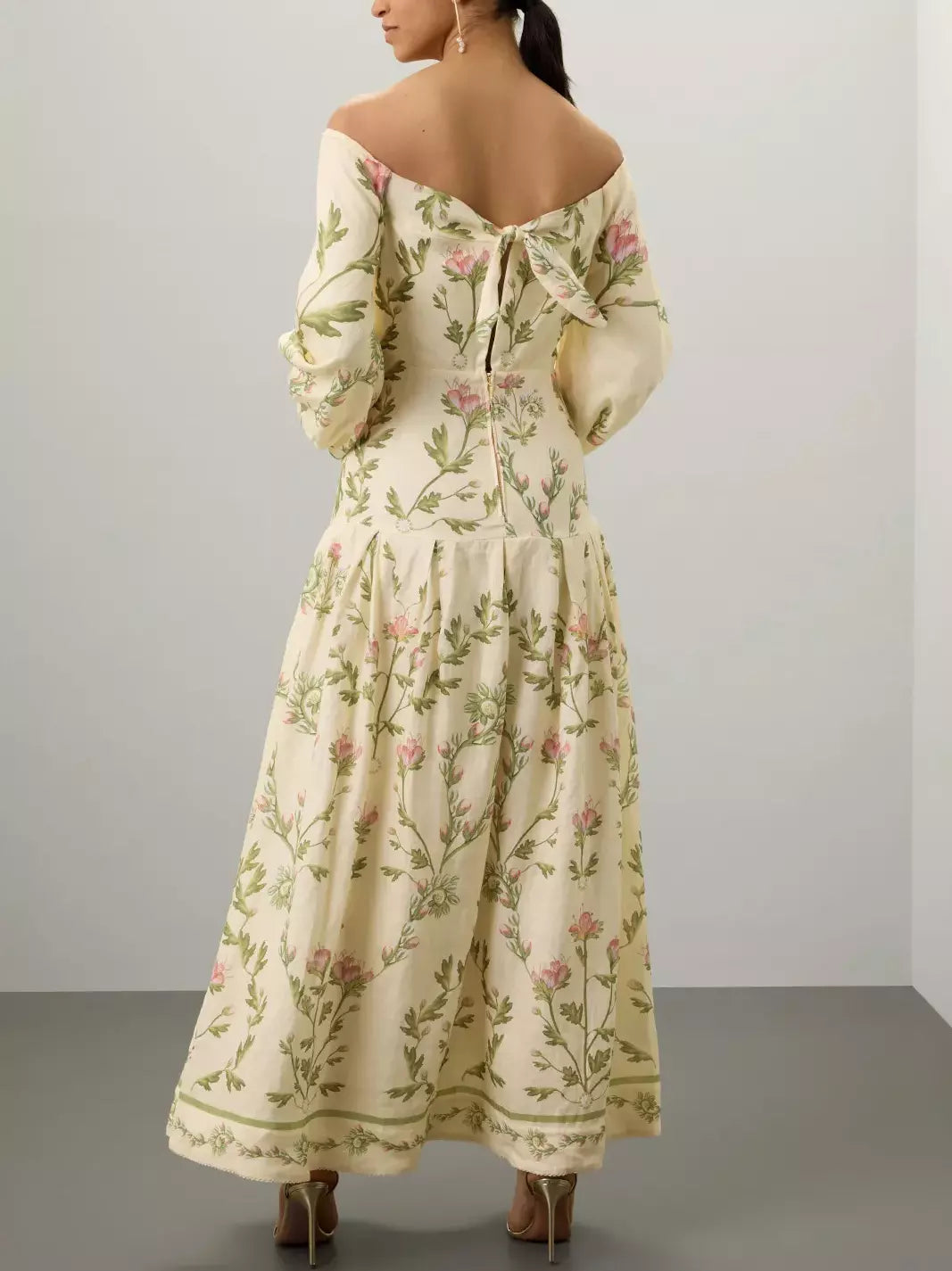 Floral Print Off-The-Shoulder Linen Maxi Dress displayed on a mannequin in a bright setting