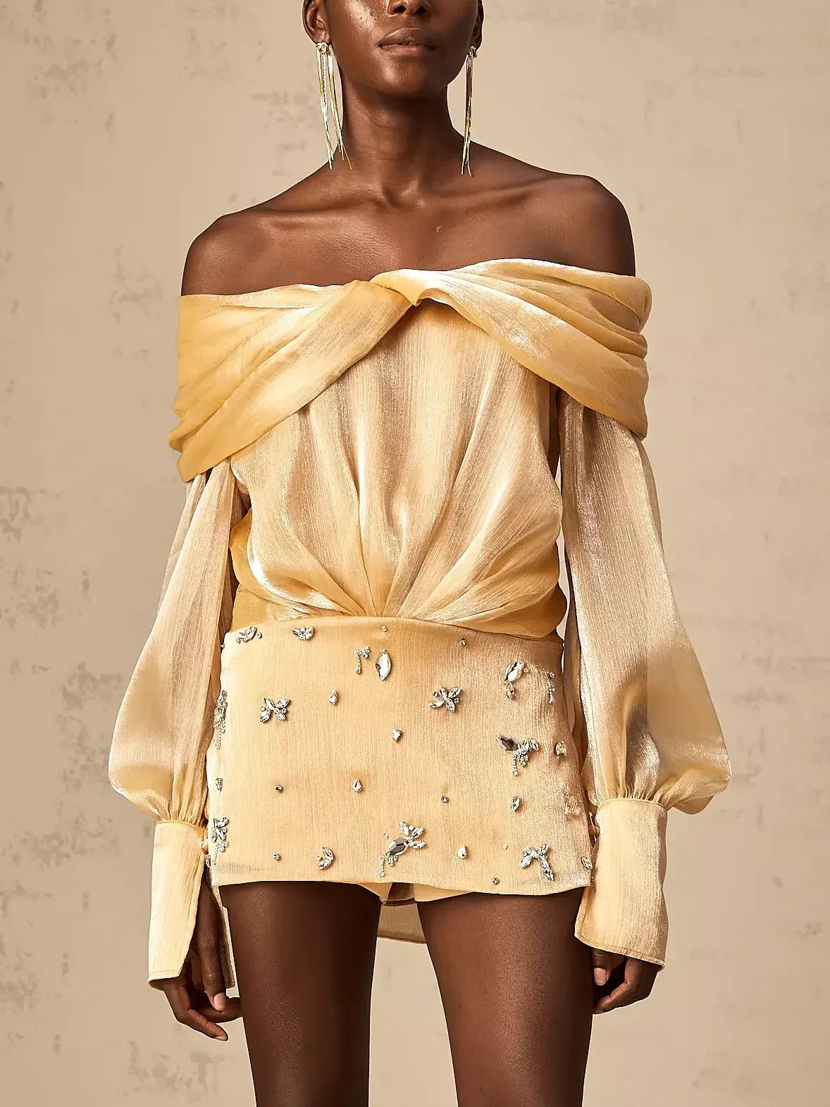 Gold off-shoulder mini dress with embellished shorts in luxurious satin style