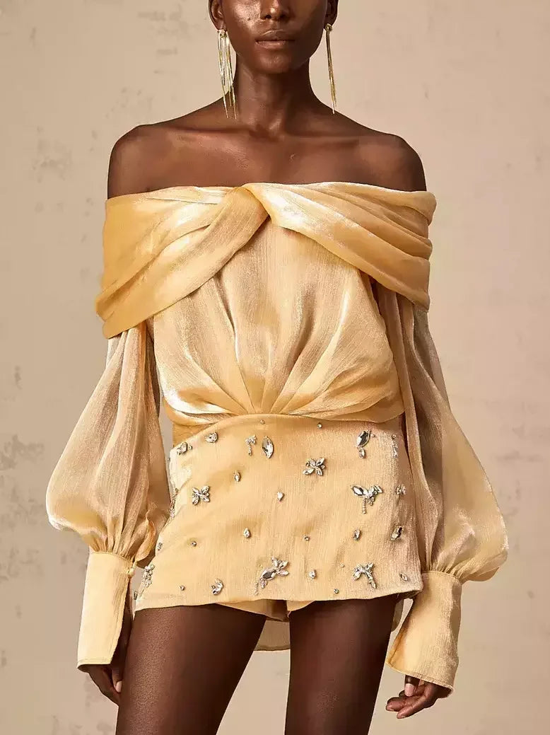 Gold off-shoulder mini dress with rhinestone embellishments in luxurious satin