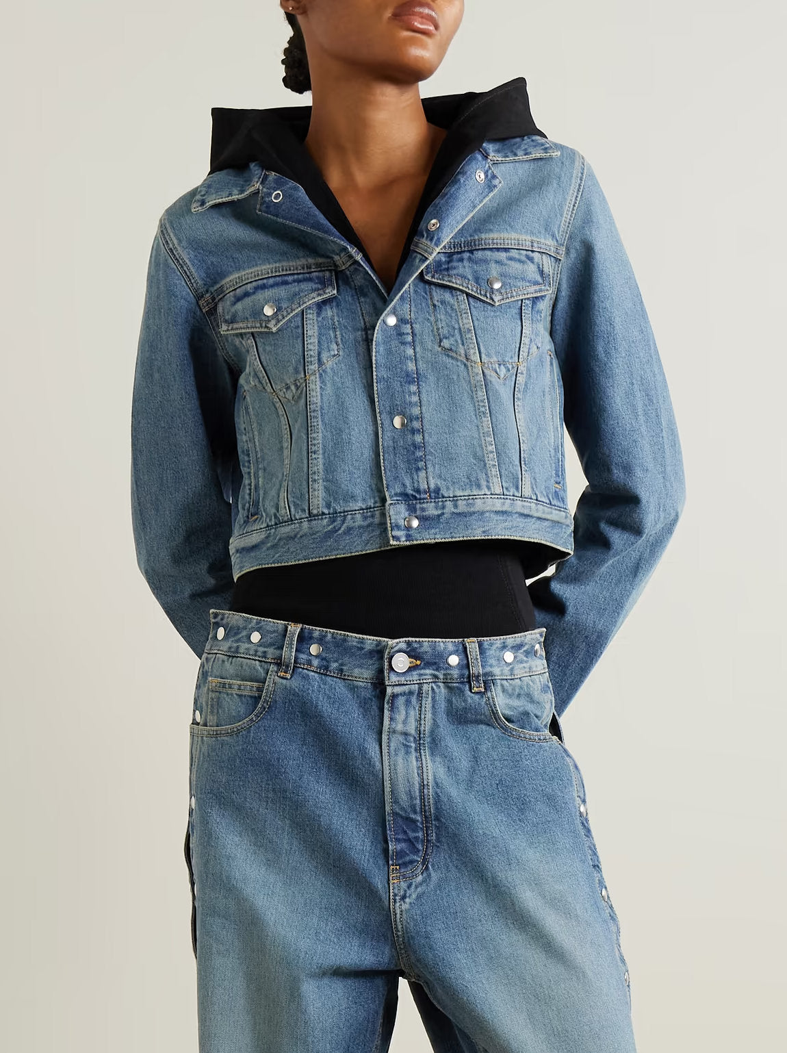 Blue denim jacket with black hood in the stylish Hooded Jersey-Trimmed Denim Jacket