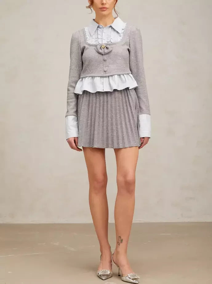 Gray sparkly pleated skirt set with a Hybrid Ruffled Striped Top and jacket