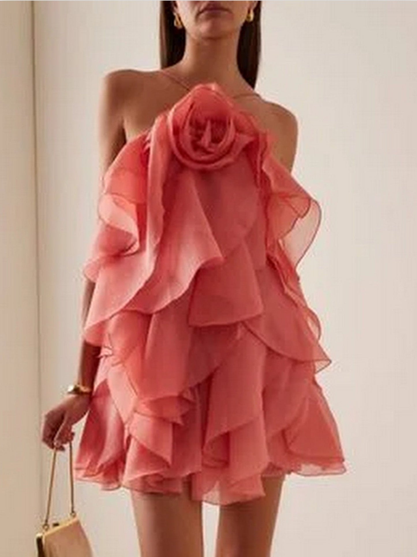 Coral layered chiffon mini dress with ruffled strapless design and rose applique