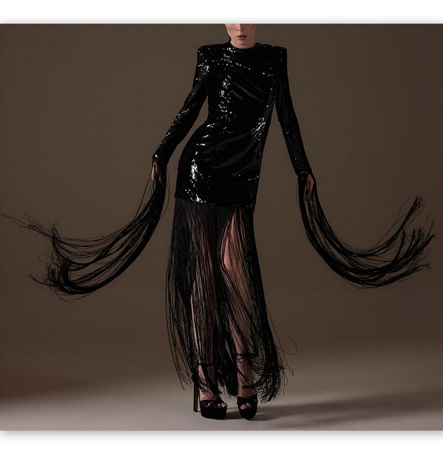 Long Black Fringed Sequin Dress featuring fringe sleeves and a stylish slit