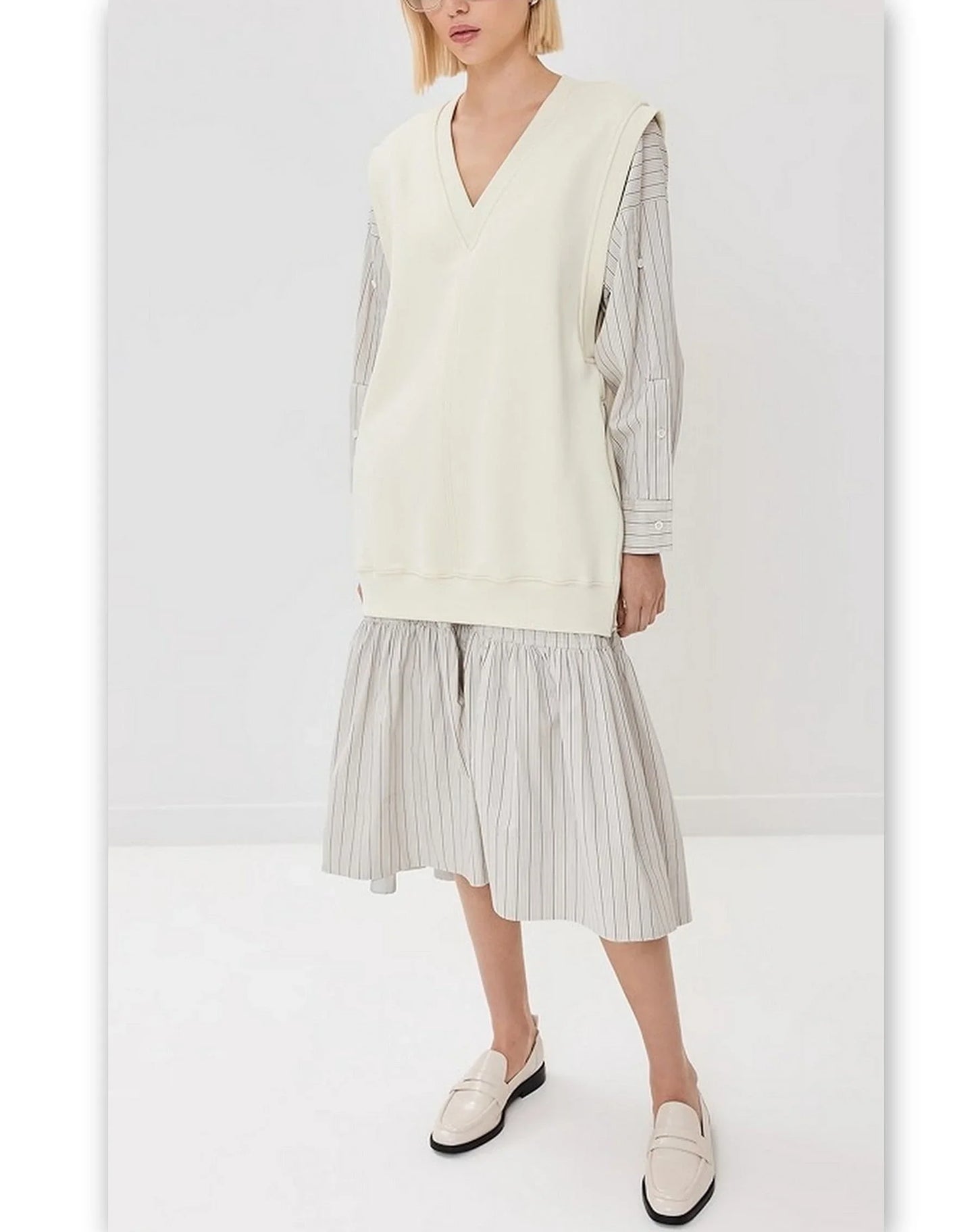 Cream-colored V-neck sweater vest from Oversized Vest Sweatshirt Striped Combo Dress