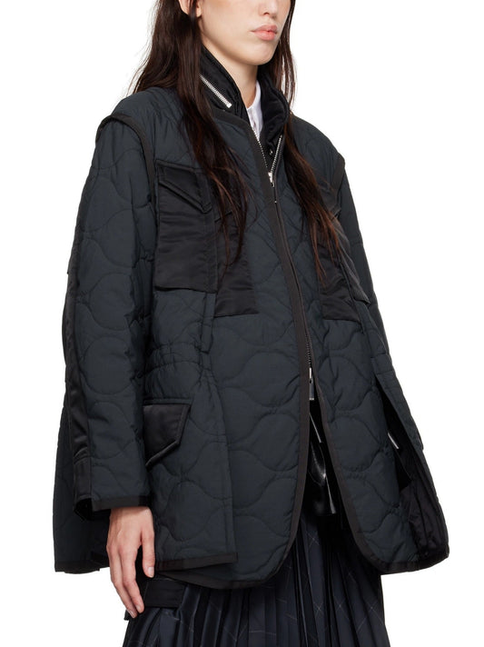 Black quilted jacket featuring a Paneled Quilted Two-Tone design in Navy