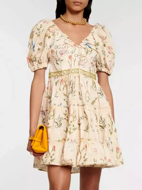 Floral print cotton tiered dress with adjustable v-neck drawstring and puff sleeves