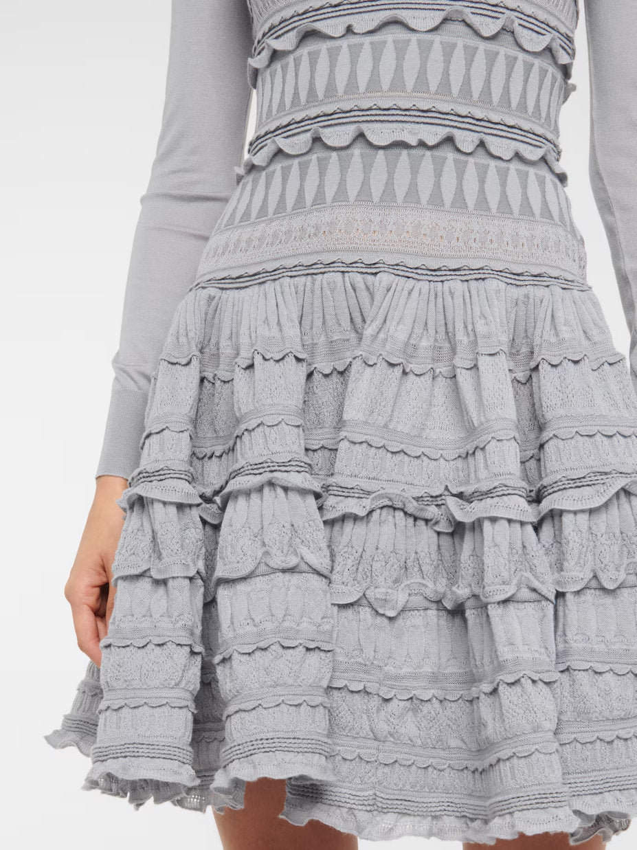 Gray Ruffled Paneled Knit Mini Dress with long sleeves and ruffled details