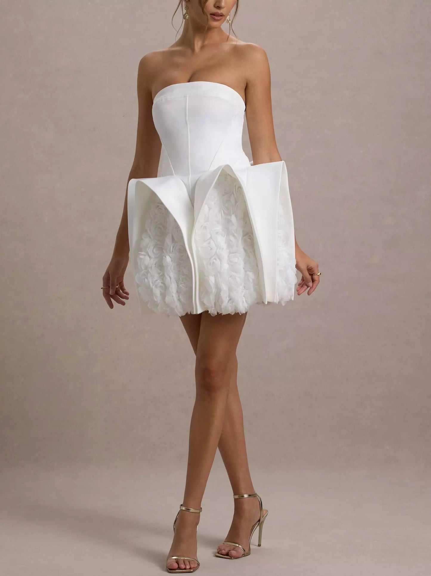White strapless mini dress featuring sculptured 3D floral design ideal for summer events