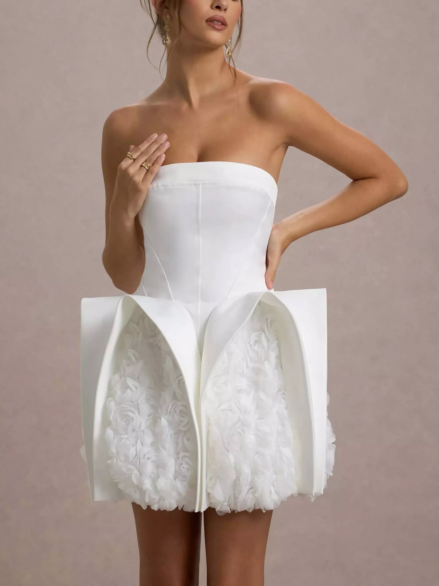 White strapless mini dress featuring sculptured 3D floral design ideal for special occasions