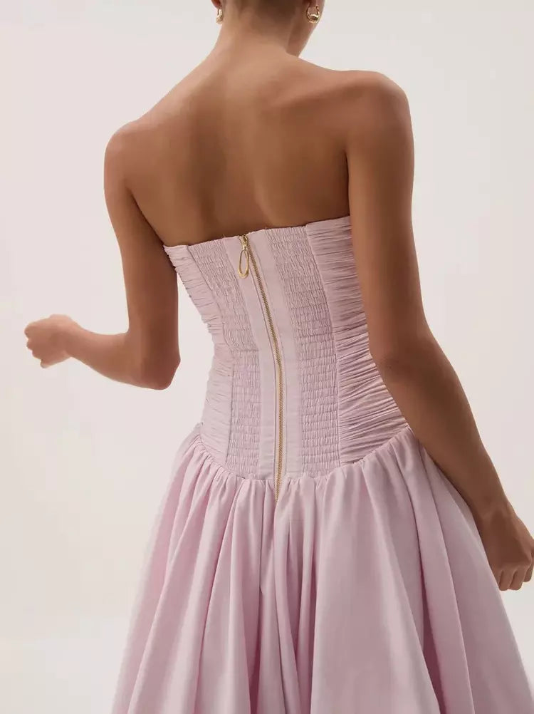 Strapless gathered long pink gown featuring a stylish corset bodice