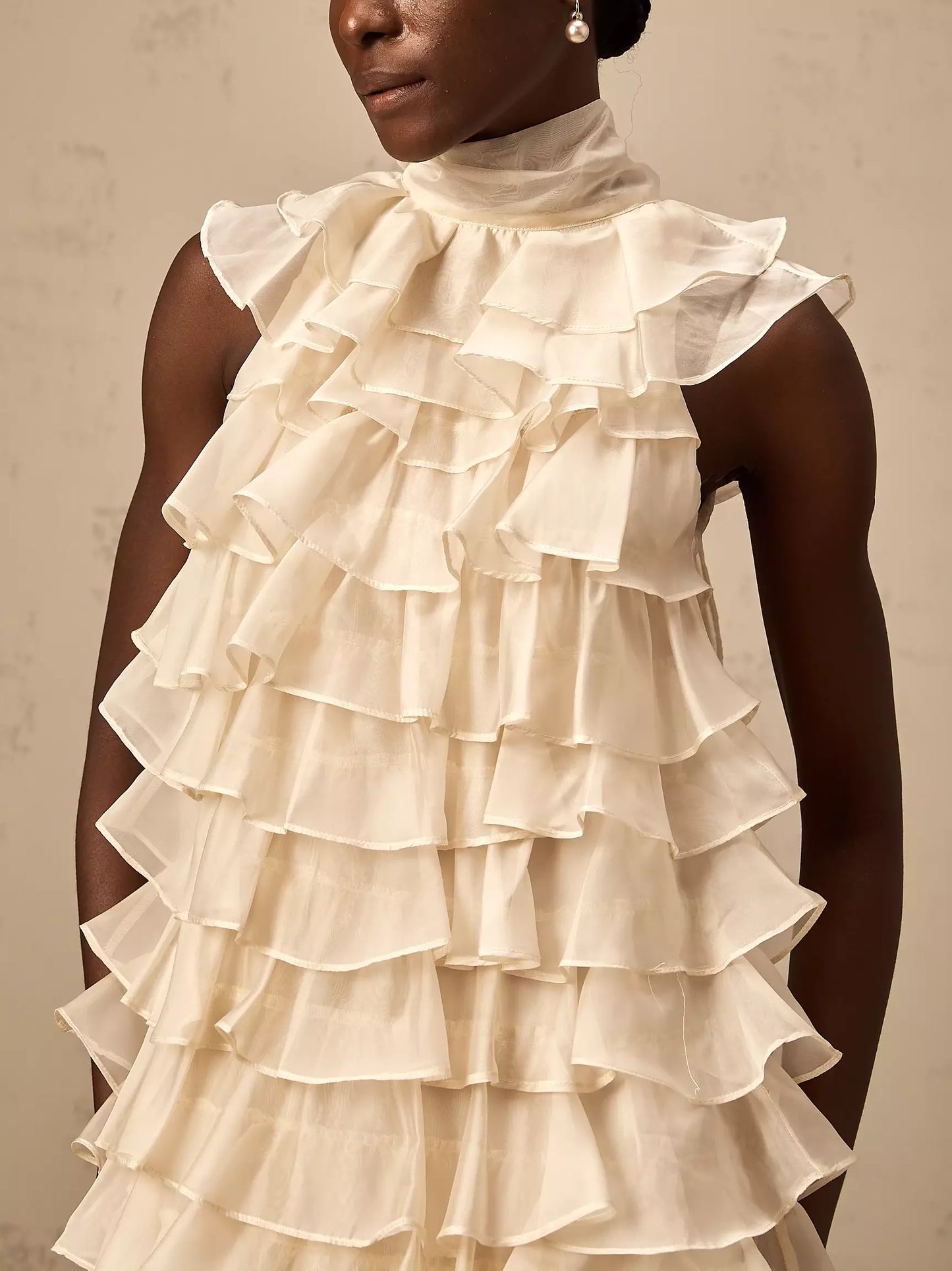 Cream-colored Tie-Neck Tiered Organza Ruffle Mini Dress with a large bow