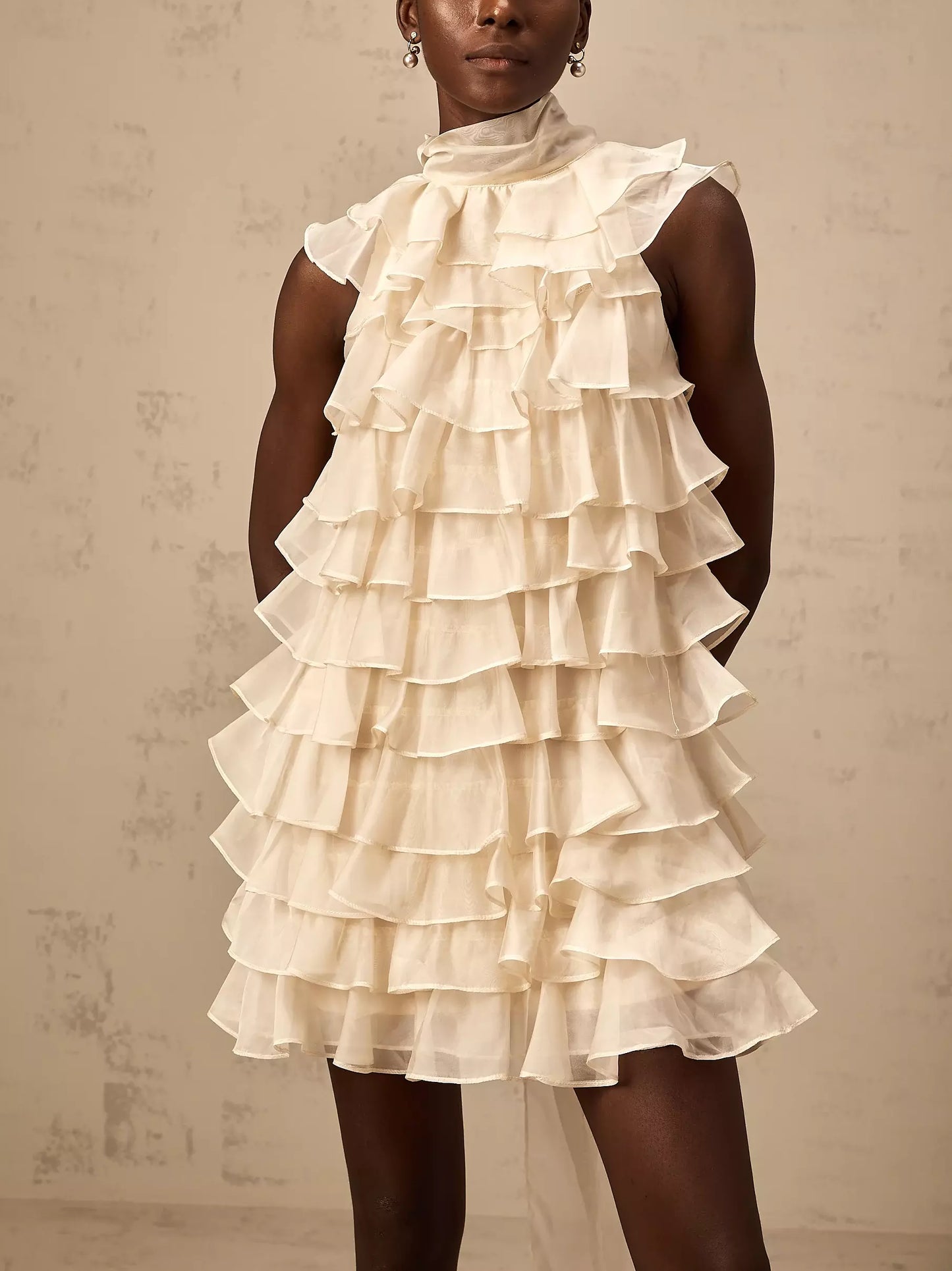 Cream-colored Tie-Neck Tiered Organza Ruffle Mini Dress with large bow detail