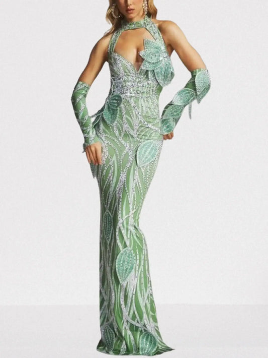 Mint green halter gown with leaf appliqué detailing and flowing silhouette