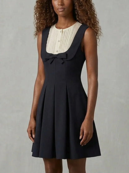 Black Sleeveless Mini Dress with Bow and Contrast Bib - Dresses